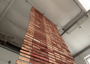 A wooden slat fence hanging from the ceiling.